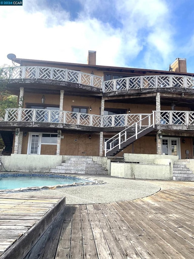 exterior space with a covered pool