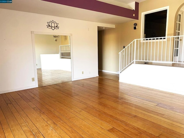 spare room featuring hardwood / wood-style flooring