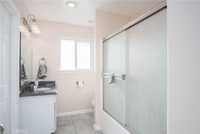 full bathroom featuring tile patterned floors, toilet, combined bath / shower with glass door, and vanity