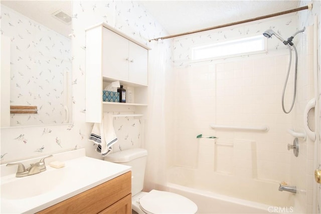 full bathroom featuring vanity, toilet, and shower / tub combo