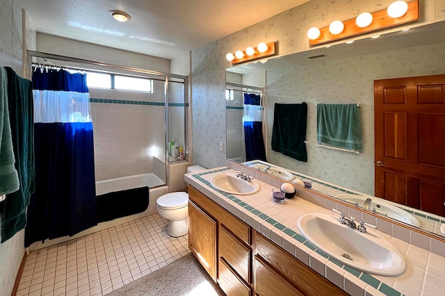 full bathroom with tile patterned flooring, vanity, toilet, and shower / tub combo with curtain