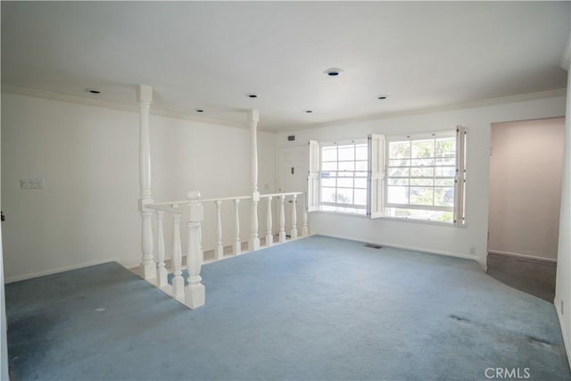 carpeted spare room with crown molding