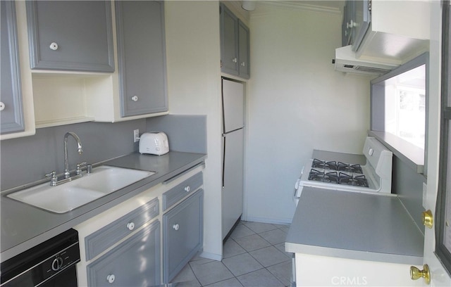 kitchen featuring range hood, sink, white appliances, light tile patterned flooring, and gray cabinetry