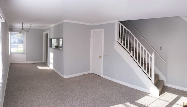 stairway featuring ornamental molding and carpet flooring