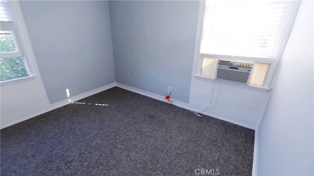 carpeted spare room with cooling unit