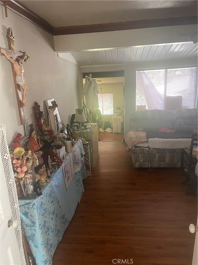 hall with dark hardwood / wood-style floors and beam ceiling