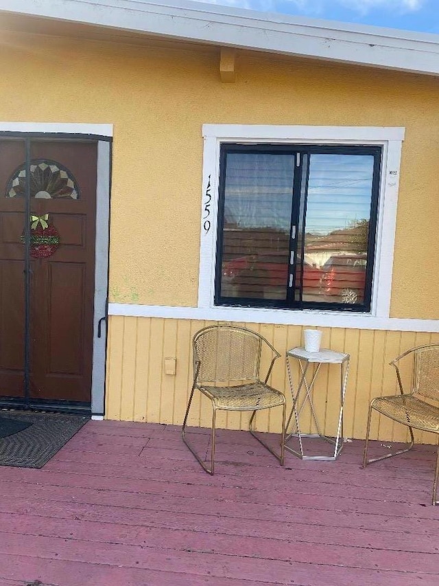 doorway to property with a wooden deck