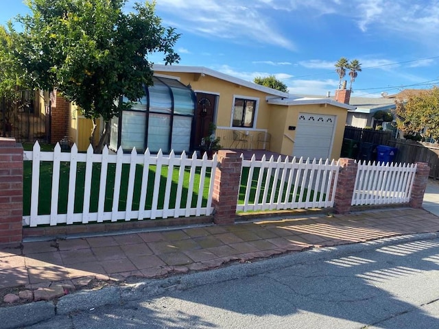 view of front facade with a front lawn and a garage