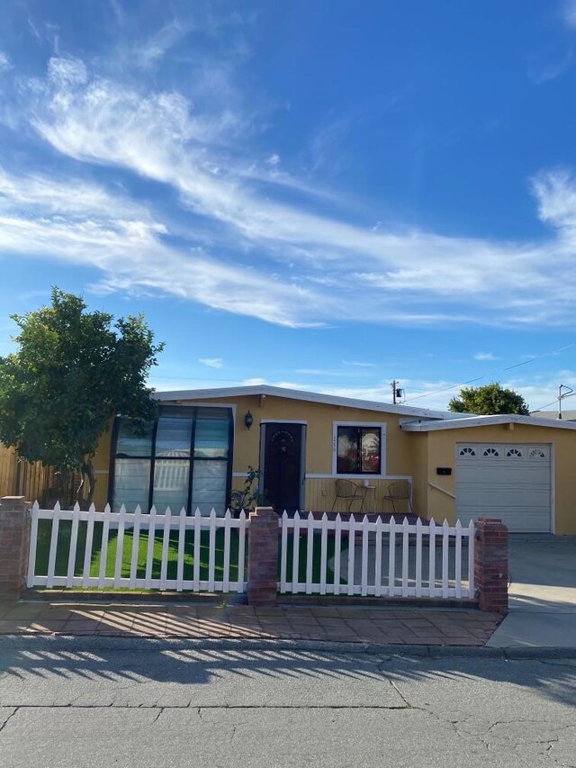 ranch-style house featuring a garage