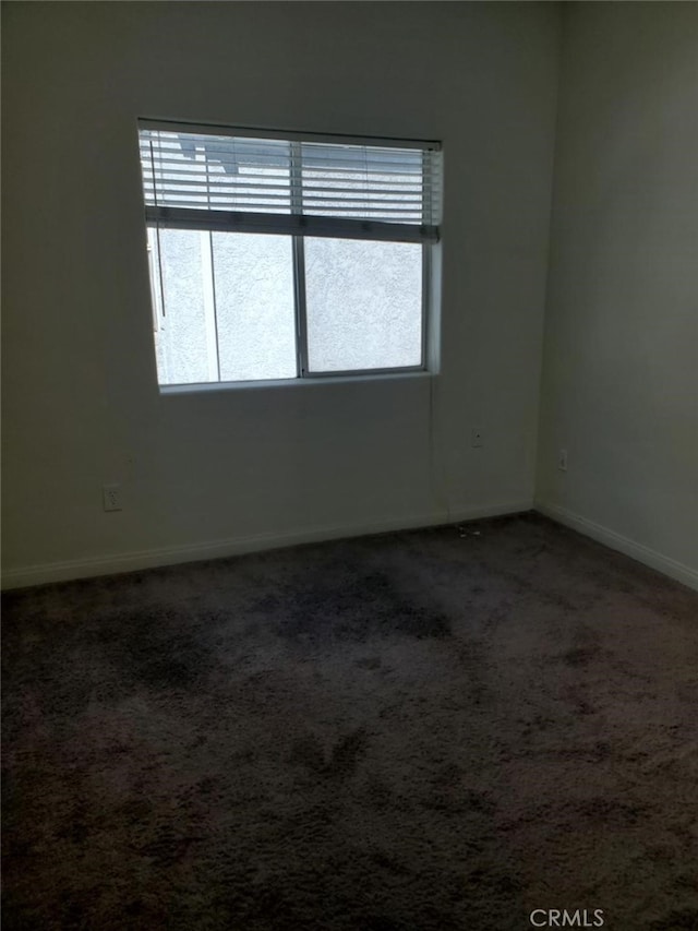 empty room with carpet flooring