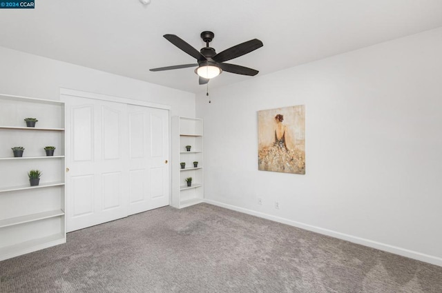 unfurnished bedroom with carpet, ceiling fan, and a closet