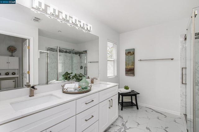 bathroom featuring vanity and a shower with shower door