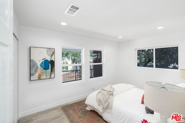 bedroom featuring light hardwood / wood-style floors