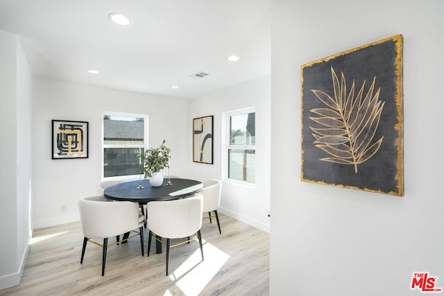 dining area featuring light wood-type flooring