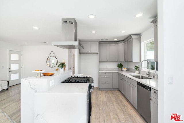 kitchen with gas range, ventilation hood, sink, dishwasher, and light hardwood / wood-style floors