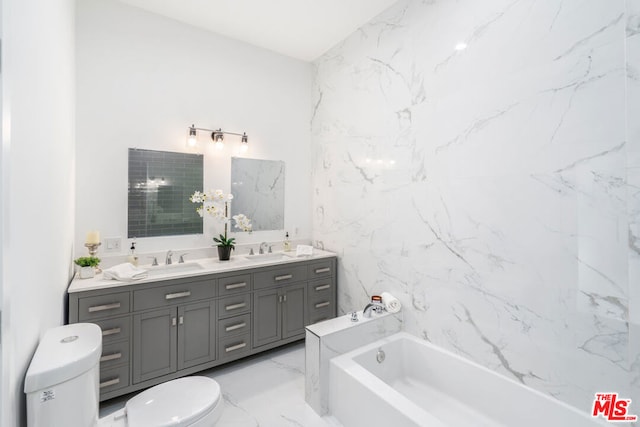 bathroom featuring a bath, vanity, and toilet