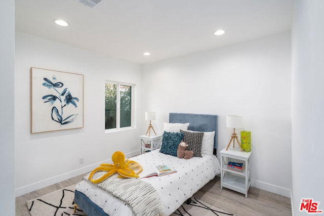 bedroom featuring light hardwood / wood-style floors