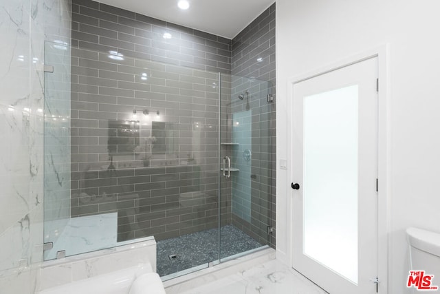 bathroom featuring an enclosed shower