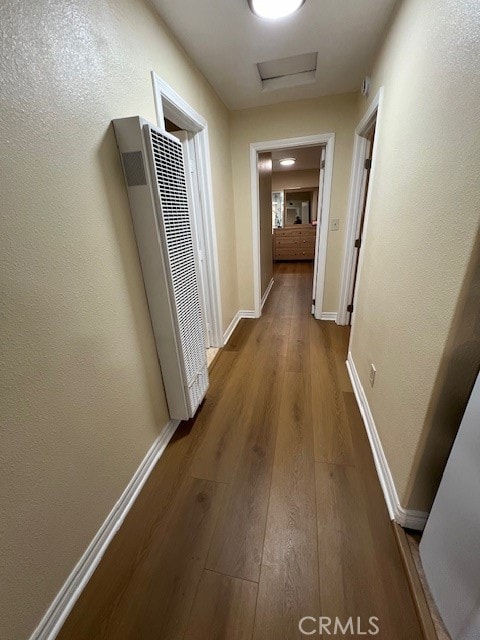 hall with hardwood / wood-style flooring