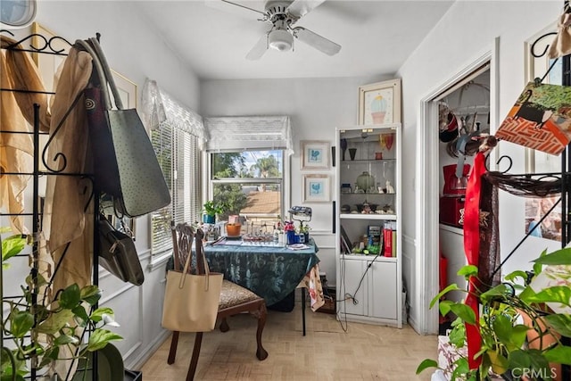 misc room featuring ceiling fan and light parquet floors