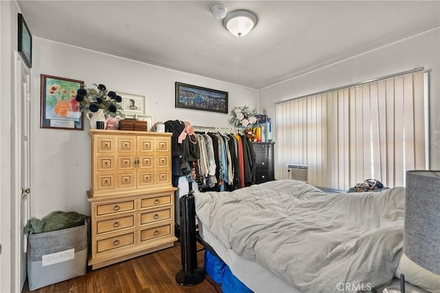 bedroom featuring dark hardwood / wood-style flooring