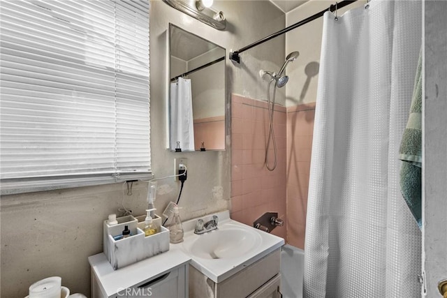 bathroom with shower / bath combination with curtain and vanity