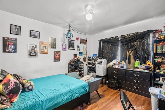 bedroom featuring light wood-type flooring and ceiling fan