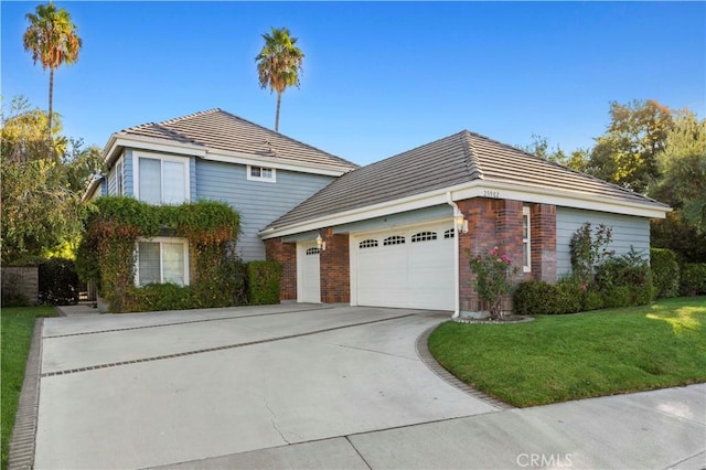 front facade with a front lawn and a garage