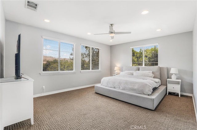 bedroom featuring ceiling fan and carpet