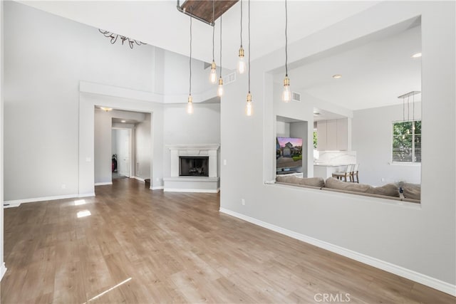 unfurnished living room featuring wood-type flooring