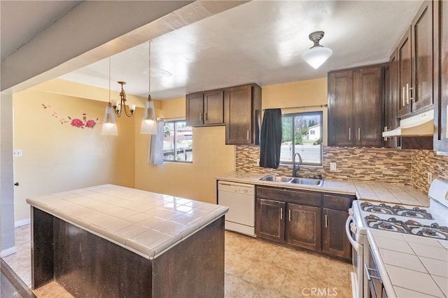 kitchen featuring tile counters, sink, a wealth of natural light, and white appliances