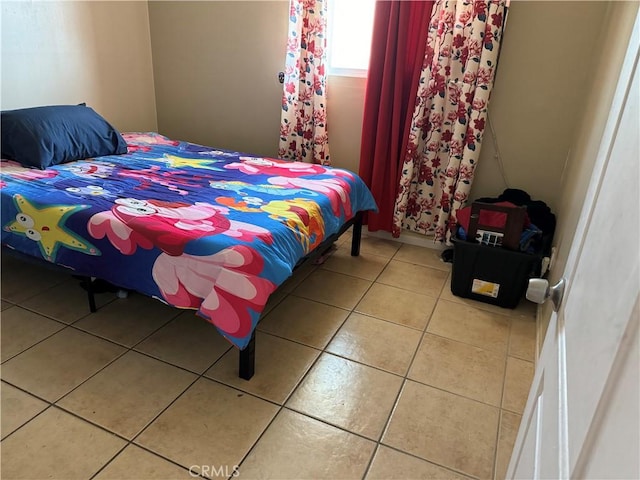 bedroom featuring tile patterned floors