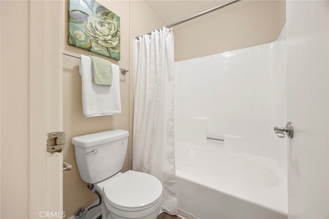 bathroom with toilet and shower / bath combination with curtain