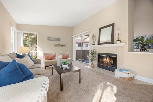 carpeted living room featuring a healthy amount of sunlight and lofted ceiling