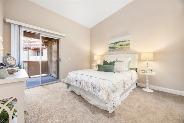 bedroom with light carpet, vaulted ceiling, and access to exterior