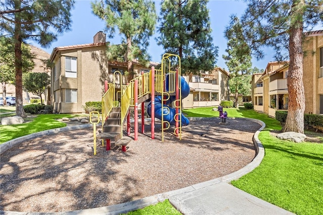 view of play area featuring a lawn