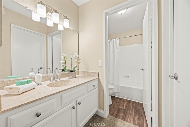 full bathroom with toilet, vanity, hardwood / wood-style floors, and shower / bath combination with curtain