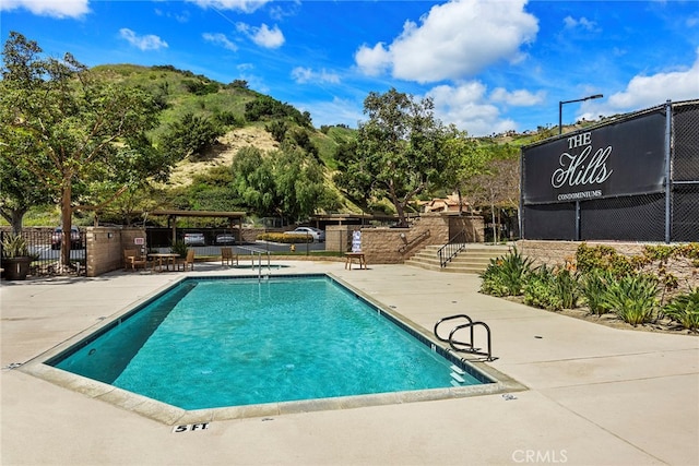 view of swimming pool featuring a patio