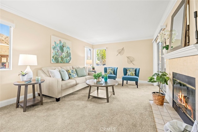 living room with ornamental molding, light colored carpet, and a tile fireplace