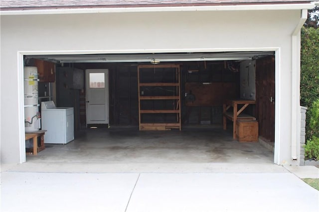 924 Oleander St, Brea, CA 92821 - garage featuring washer and clothes dryer, concrete driveway, and secured water heater