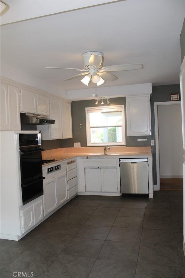 924 Oleander St, Brea, CA 92821 - kitchen with stainless steel dishwasher, white cabinets, black oven, and a warming drawer