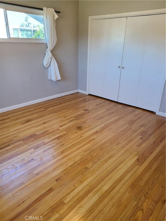 924 Oleander St, Brea, CA 92821 - unfurnished bedroom with wood finished floors and a closet