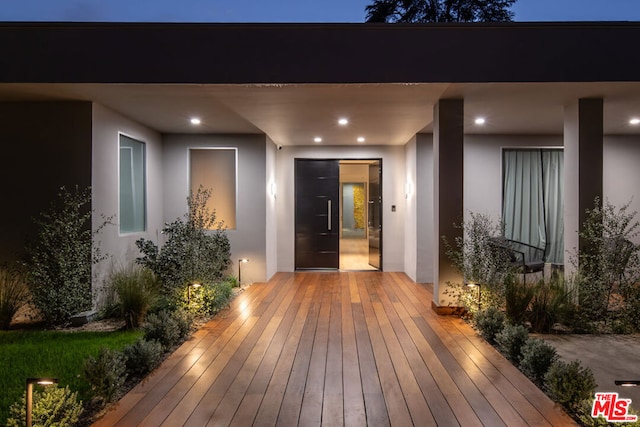 entrance to property featuring a deck