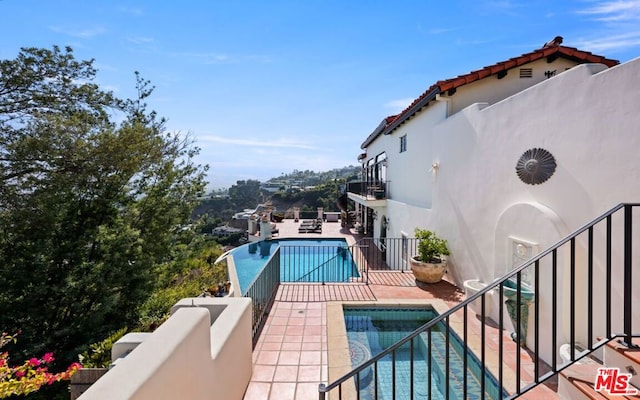 view of pool featuring a patio