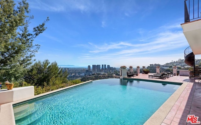 view of pool featuring a patio area