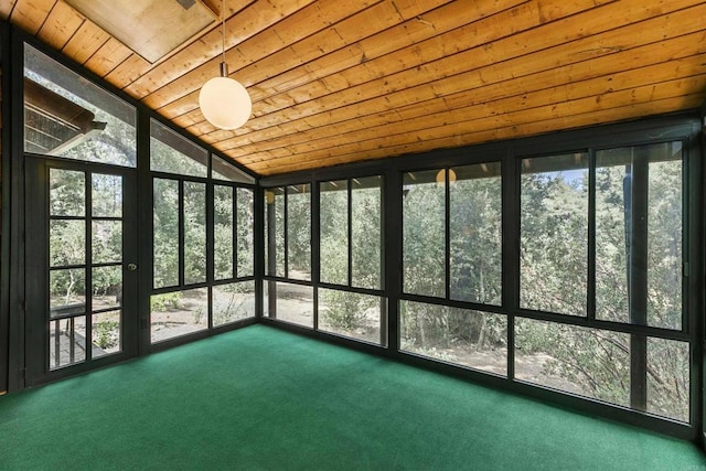 unfurnished sunroom featuring lofted ceiling and wooden ceiling