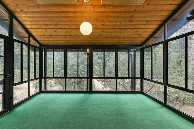 unfurnished sunroom with lofted ceiling and wooden ceiling