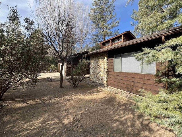 view of home's exterior featuring stone siding