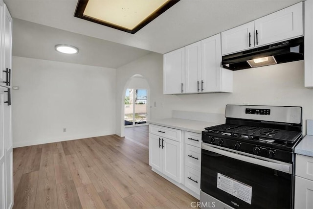 6818 El Sol Ave Unit 29, Palms, CA 92277 - kitchen with stainless steel gas range oven, under cabinet range hood, arched walkways, and light countertops