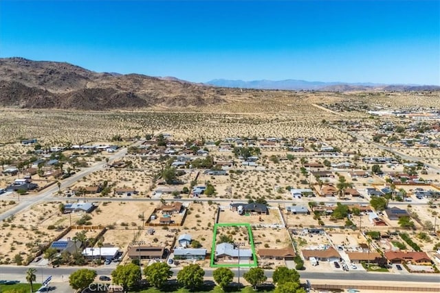 6818 El Sol Ave Unit 29, Palms, CA 92277 - view of property location featuring a mountain backdrop, property parcel outlined, and a desert landscape
